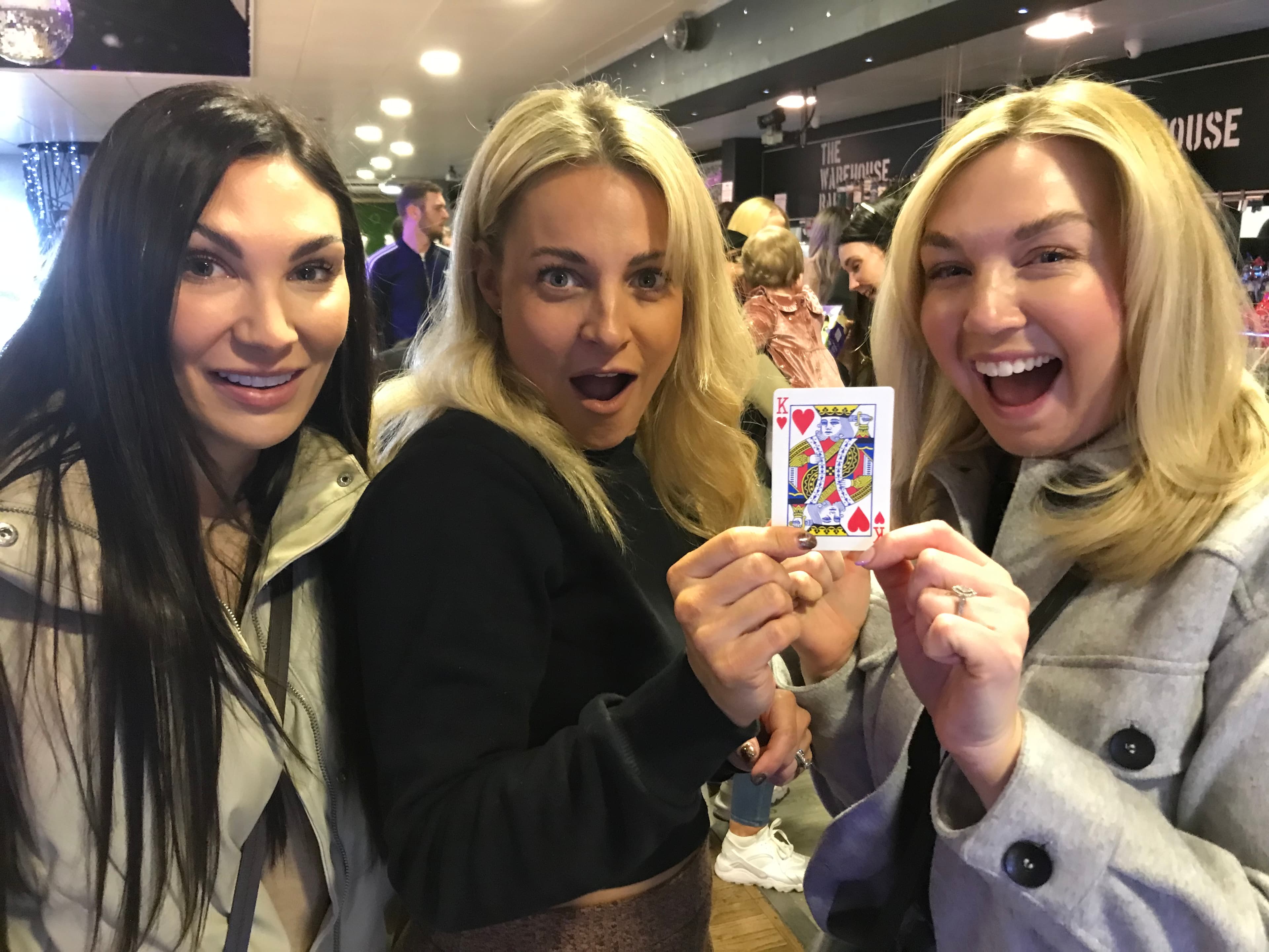A group of woman impressed with a magic trick
